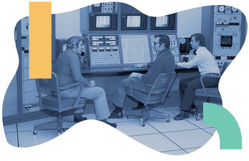 Vintage duotone image of three men working on a control panel