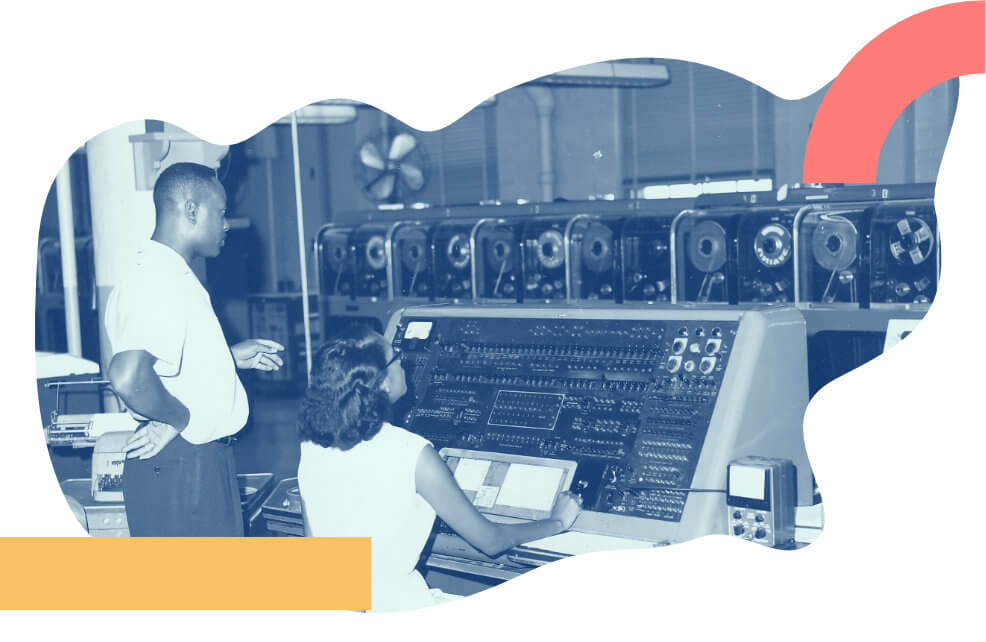 A team working in a vintage computer room with tapes to illustrate DNS no lock-in vendor policiy.
