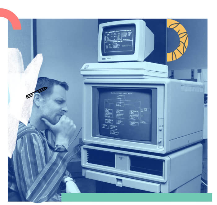 Vintage image of Anthony thinking hard in front of a 80's computer